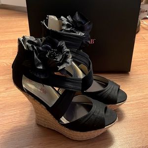 Black espadrilles with flower accent Size 8.